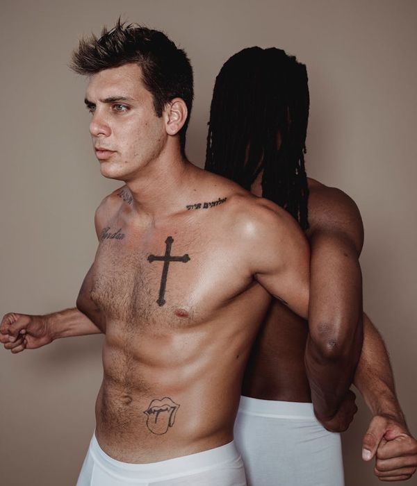 Man performing a strength exercise in a modern, minimalist gym.